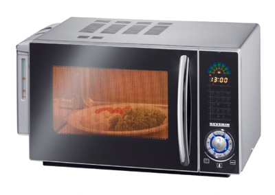 Vemos un horno que esta en funcionamiento donde se ve un recipiente dentro